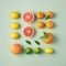 Creative citrus fruit flat lay. Summer healthy food concept.