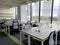 creative co working space office center with black chair,cream table,white wallpaper modern open space or shared