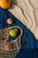 Creative composition made of fruits and mesh bag on beach towel. Summer background. Vegan and vegetarian food concept. Zero west