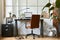 Creative composition of modern masculine home office interior design with black industrial desk, brown leather armchair, laptop.