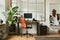 Creative composition of modern masculine home office workspace interior with black industrial desk, brown leather armchair, pc.