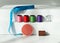 Creative composition with spools of colored threads and scissors. Sewing accessories, tailoring set