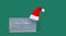 Creative concept of new year, medical mask, santa hat, on green background .Flat lay, top view, copy space. Banner