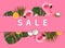 Creative concept of summer sales. Inflatable pink mini flamingo tropical palm leaf monstera coconut orange on pink background pool