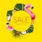 Creative concept of summer sales. Inflatable pink mini flamingo tropical palm leaf monstera coconut orange on yellow background