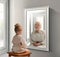 Creative conceptual collage. Little girl looking in mirror and seeing reflection of senior lady. Her future self. Child