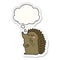 A creative cute cartoon hedgehog and thought bubble as a printed sticker