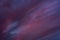 creative dark background. violet-red-blue twilight sky with overcast and crimson glow