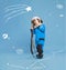 Creative design with drawn elements. Portrait of little boy, child in costume of astronaut over blue background. Playful