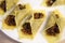 Creative dish for appetizers or party food, fried won-ton, The fried pastry is filled with: onions, garlic and basil flavored with