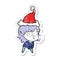 A creative distressed sticker cartoon of a elf girl staring and crouching wearing santa hat