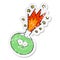 A creative distressed sticker of a cartoon potion exploding