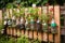 creative diy garden project with recycled materials, such as old bottles and cans