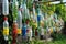 creative diy garden project with recycled materials, such as old bottles and cans