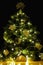 Creative DIY handicrafted Christmas tree decoration on black background