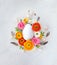 Creative Easter concept made of eggs feathers and spring flowers around on vintage background. Flat lay