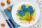 Creative Easter salad decorated with colored blue egg