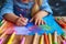 Creative endeavor Child paints a vibrant picture with colorful crayons