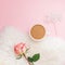 Creative flat lay overhead top view coffee milk latte cup rose flower on millennial pink background copy space minimal style. Fall