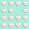 Creative Flat lay with Pink polygonal paper heart shape on mint color paper. Love concept. Pastel colored pattern