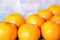 Creative flat lay top view of fresh orange fruit on blue wooden background with copy space. fresh citrus mock up