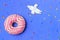 Creative Food Minimalism, Donut in Shape of Planet in Blue Sky with Space Ship Top View, Copy Space.