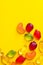 Creative food poster banner card template. Gummy jelly candies in shape of different summer tropical fruits arranged in pattern