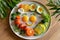 Creative Food Presentation of a Smiley Face Breakfast Plate with Vegetables and Eggs