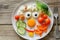 Creative Food Presentation of a Smiley Face Breakfast Plate with Vegetables and Eggs