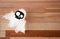 Creative ghost prepared for Halloween celebration on wooden background