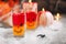 Creative glasses with drink prepared for Halloween party on table