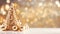 Creative gold christmas tree with balls and glitter on blurred, sparkling lights background. Festive mockup banner with baubles