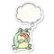 A creative grumpy cartoon frog and thought bubble as a distressed worn sticker