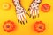 Creative Halloween background with witch hands and pumpkins