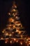 Creative handmade christmas tree illuminated in the dark