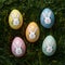 Creative holiday decoration colorful eggs with bunny faces, DIY