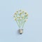 Creative idea with bulb and wild flower. Abstract floral bulb on pastel blue background. Energy technology and floral nature