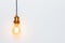 Creative idea concept, designer lamp, modern interior item. Vintage fashionable edison lamp on light gray background