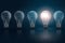 Creative idea concept with light bulbs and one of them is glowing. Leadership, individuality, opportunities business