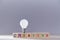 Creative idea generation. Innovation and creativity. Insight and originative thinking. Wooden cubes, lightbulb on top