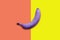 Creative idea purple banana on a colored background