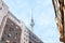 Creative Illustration - Berlin Television Tower, perspective from a downtown street, with historic buildings