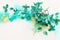 Creative image of emerald and green Hydrangea flowers on artistic ink background. Top view with