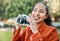 Creative juices flowing. a young woman holding her camera while standing outside.