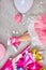 Creative lay out of funky leg of girl in pink sneakers and dress, flat lay