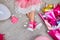 Creative lay out of funky leg of girl in pink sneakers and dress, flat lay