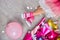 Creative lay out of funky leg of girl in pink sneakers and dress, flat lay
