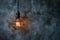 Creative lighting hanging lightbulb on industrial cement background