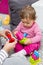 Creative Little child playing with educational colorful plastic blocks