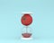 Creative made of tomato hourglass on blue color background. mini